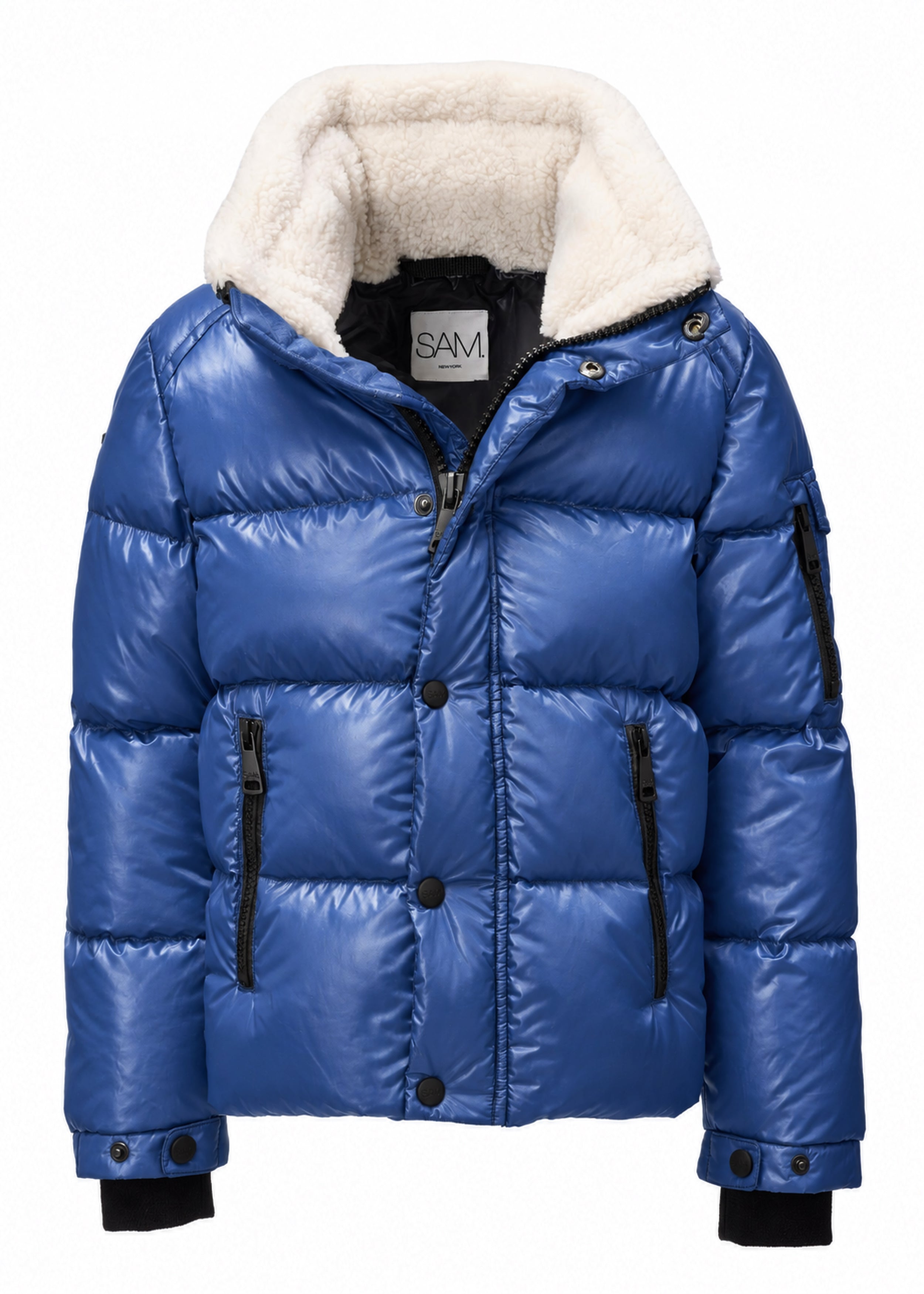 BOYS FRONTIER A royal blue puffer jacket with a thick cream-colored sherpa lining on the hood, black zipper details, and black cuffs, shown against a plain white background.