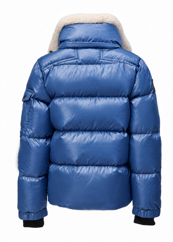 BOYS FRONTIER A royal blue puffer jacket shown from the back, featuring horizontal quilting, a high collar with a cream-colored faux fur lining, and black cuffs.