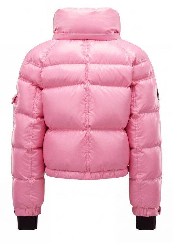 GIRLS CROPPED FREESTYLE A shiny pink puffer jacket shown from the back, featuring horizontal quilting, a high padded collar, and black ribbed cuffs, set against a plain white background.