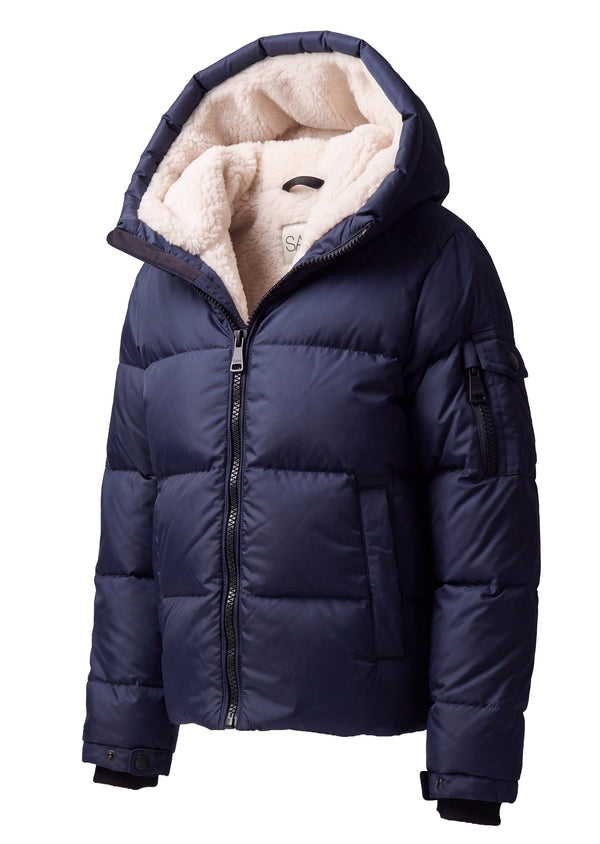 TODDLER BOYS SHERPA PARKER A navy blue hooded puffer jacket with a plush cream-colored fleece lining, shown on a plain white background.